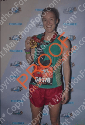 Thrilled to have finished a race. Not thrilled to be soaking wet.