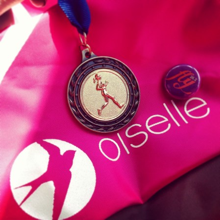 My medal and a side of my Oiselle spike bag